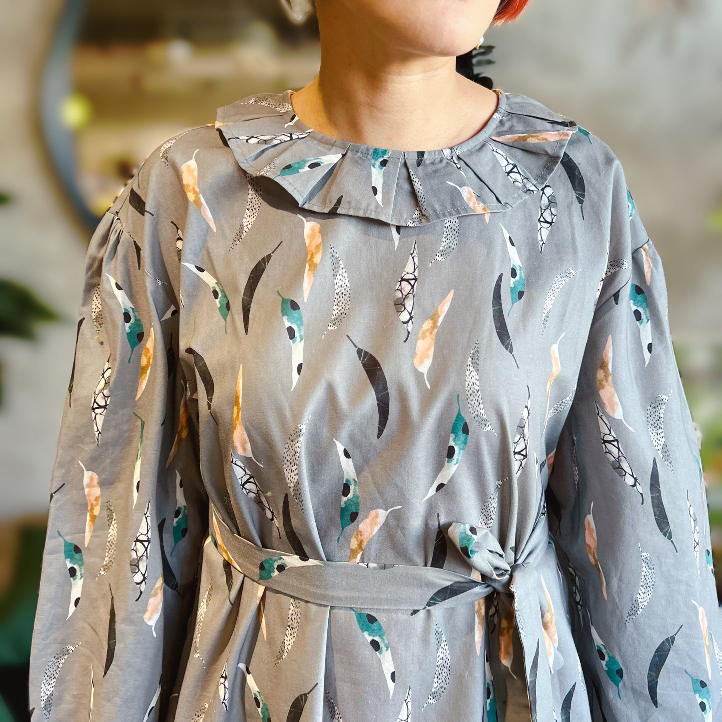 Feathers and pattern dress