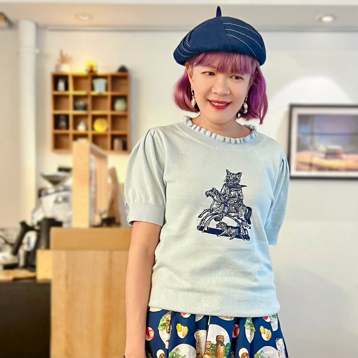 Cat riding wooden horse sweater