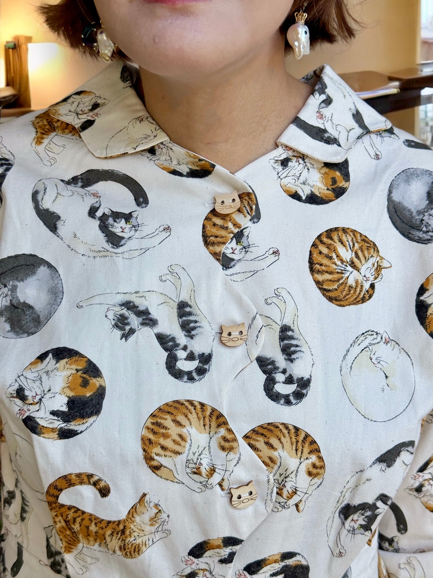 Cats in circle pattern shirt :
